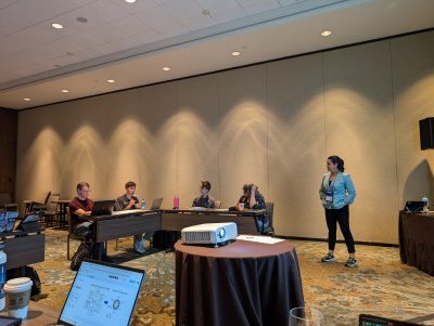 An undergraduate student from the workshop team contributing to a workshop session at the AAPT 2024 Summer Conference.